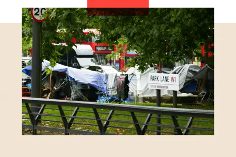 Alamy An encampment of tents on Park Lane in London