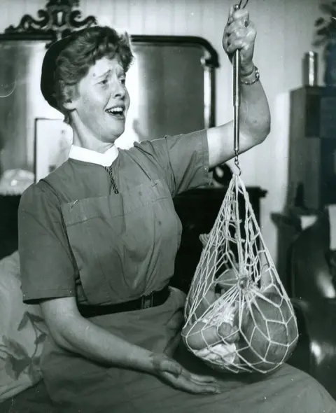 Denis Straughan, The Scotsman Nurse weighing baby