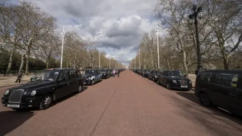 PA Media Black cabs parked on the Mall