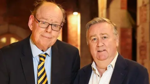 Press Eye/PA Media Former UTV political editor Ken Reid and former BBC NI political editor Stephen Grimason were honoured by Queen's University in January