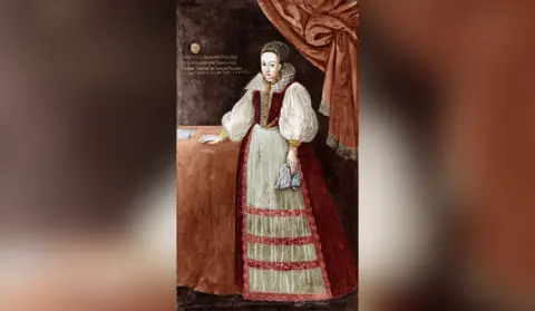 Getty Images Elizabeth Bathory shown in a painted portrait. She is holding a cloth in one hand and the other rests on a table