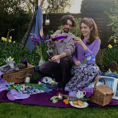 Helen Yang Helen Yang and Thomas Etheridge in purple outfits