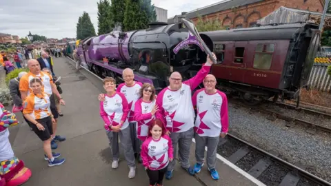 Getty Images Pauline Smith, Nicholas Birkmyre, Elaine Ball, Jess Benyon, Steven Walker and Richard Riley take part in The Queen's Baton Relay as it visits Bridgnorth as part of the Birmingham 2022