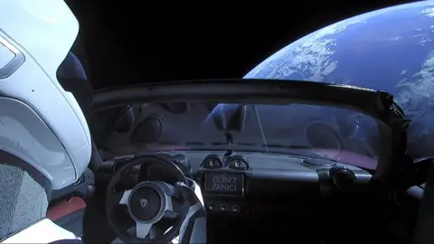 SPACEX A sign on the dashboard reads "Don't Panic", a nod to the Hitchhiker's Guide to the Galaxy