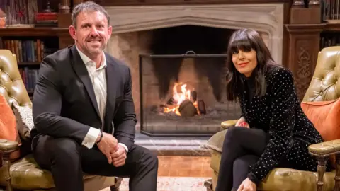Lamberty Paul Chappells Andrew Jenkins pictured with Traitors host Claudia Winkleman.