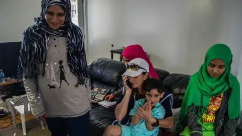 Andreane Williams Ms Lapierre meets with a family of Syrian refugees in Saint-Jerome