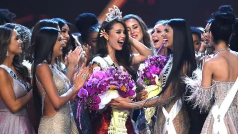 Getty Images Beauty queens congratulating the newly-crowned Miss Universe